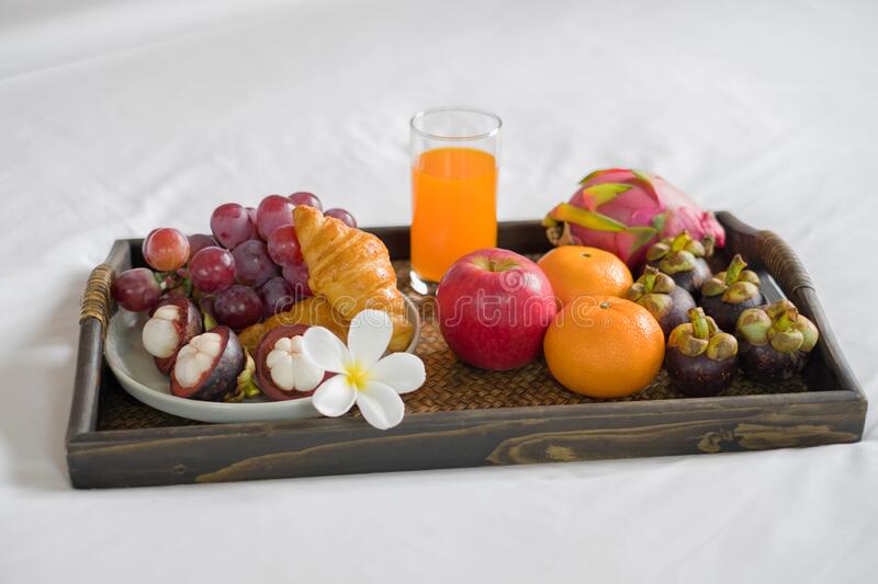 Focus On Fruit. In A Hotel Room With Fruit, Place A Tray On The Bed To  Welcome The Arrival Of Vip Guests Stock Photo - Image Of Bread, Interior:  233506746