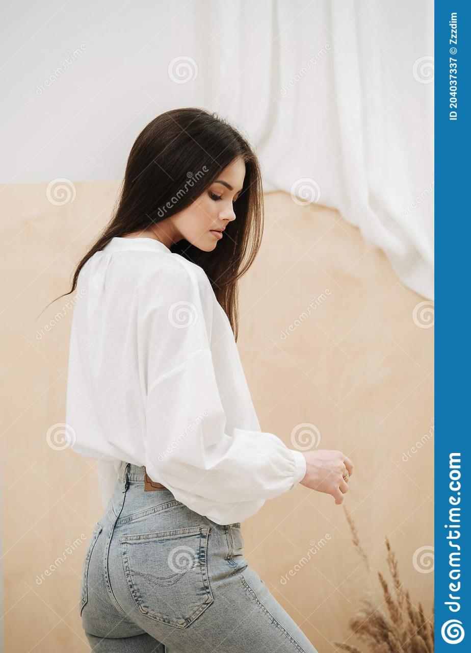 Beautiful Woman Wearing Tight Jeans And White Shirt. View From The Side.  Stock Image - Image Of Person, Bouquet: 204037337